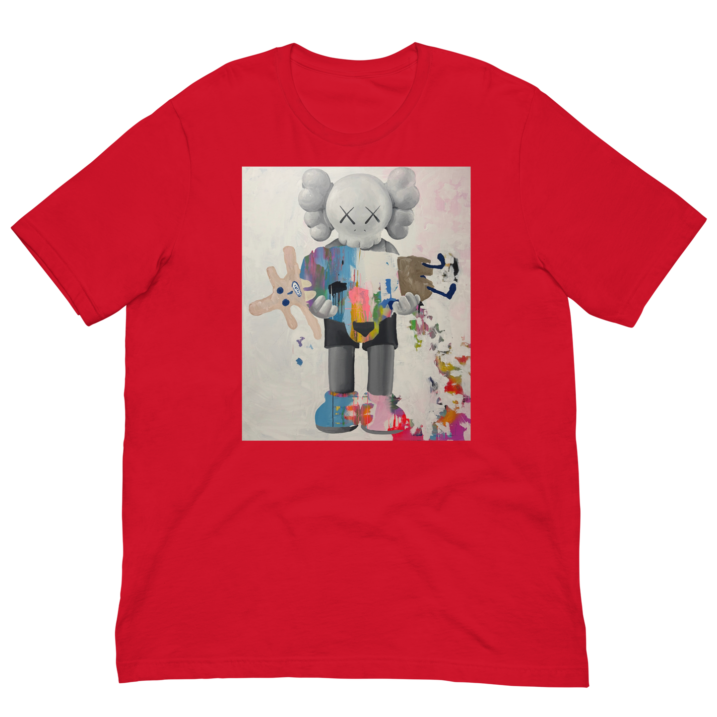 A red short-sleeve crewneck t-shirt featuring a large square graphic print on the chest. The graphic shows a stylized cartoon character resembling KAWS, holding a pink and blue paint palette, with paint splatters on a light background. Daniel Maltzman artist. 