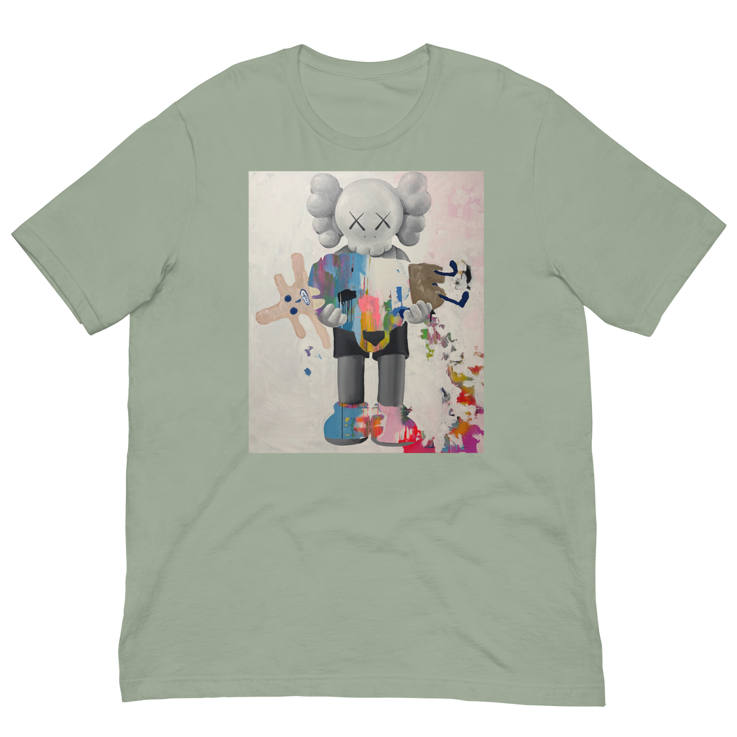 A sage green crewneck t-shirt featuring a large graphic print of a stylized cartoon character resembling KAWS, holding a pink plush toy, displayed on a solid white background. Daniel Maltzman artist. 