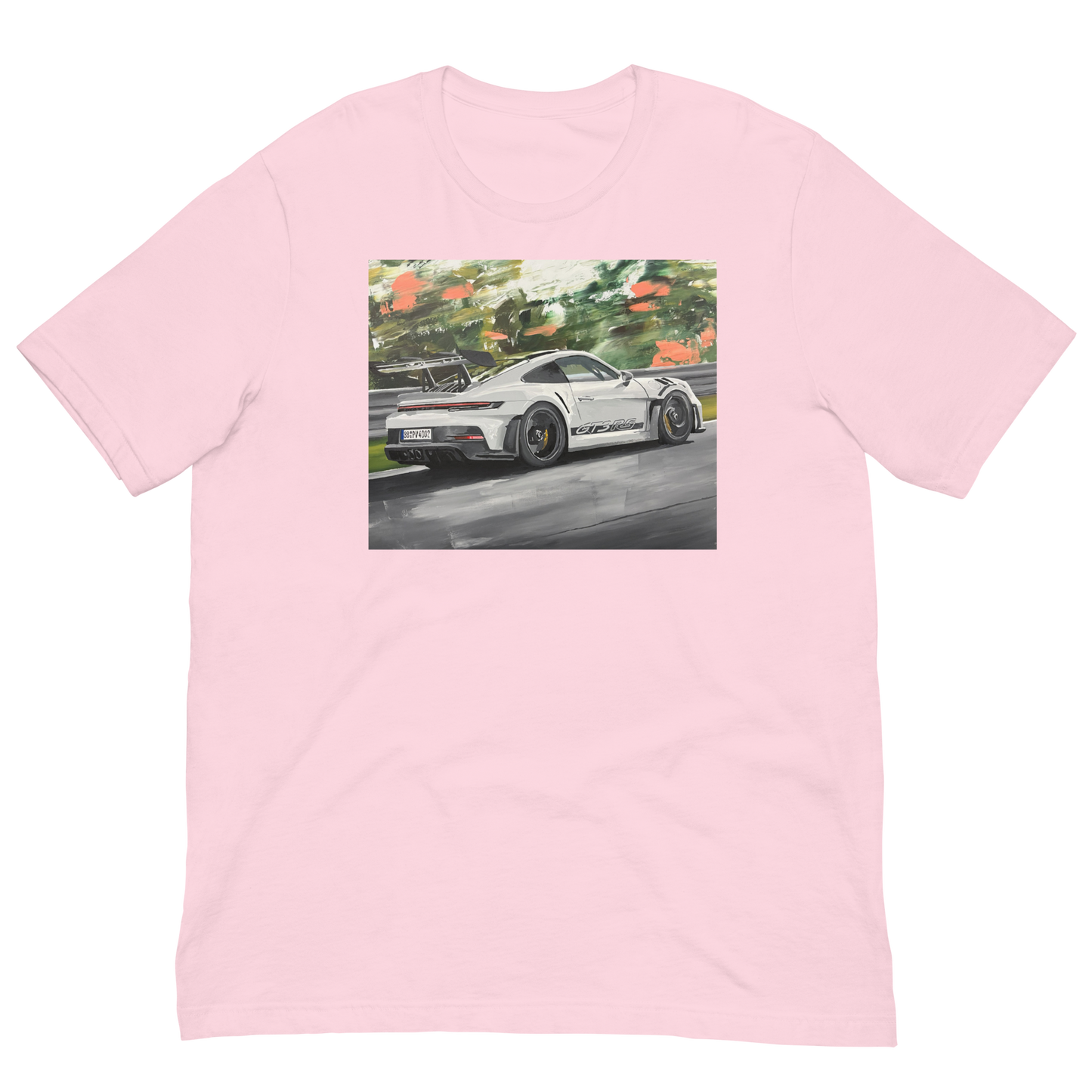 A light pink short-sleeve crewneck t-shirt featuring a rectangular graphic print of a white sports car on a racetrack surrounded by green trees. Daniel Maltzman original desgn. 