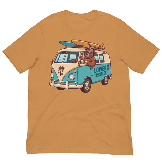 A mustard yellow short-sleeve crewneck t-shirt featuring a retro-style graphic of a split-tone blue and beige van with a bear driving it, carrying surfboards on top, and the text 'LOWER TRESTLES' on the side.