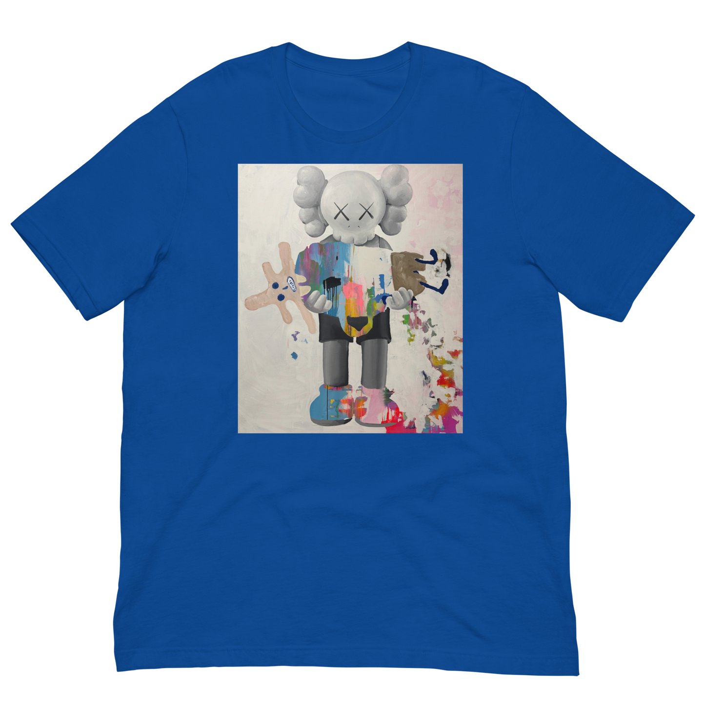A royal blue short-sleeve crewneck t-shirt featuring a large square graphic print on the front. The graphic depicts a stylized cartoon character resembling KAWS, holding a pink plush toy, set against a light textured background with colorful paint splatters. Daniel Maltzman artist. 