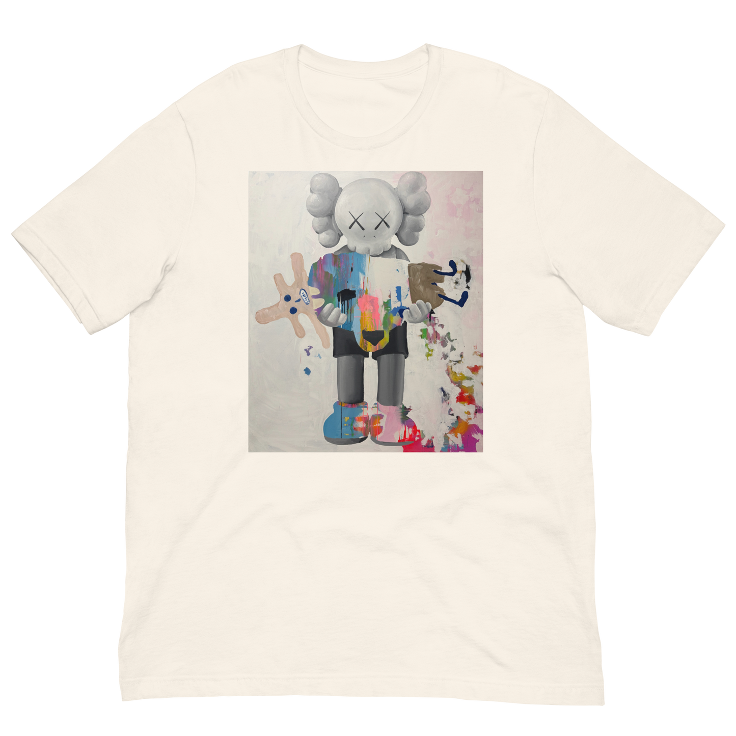 An off-white crewneck t-shirt featuring a central graphic print of a stylized cartoon character resembling KAWS, holding a pink and blue paintbrush and surrounded by colorful paint splatters. Daniel Maltzman artist. 