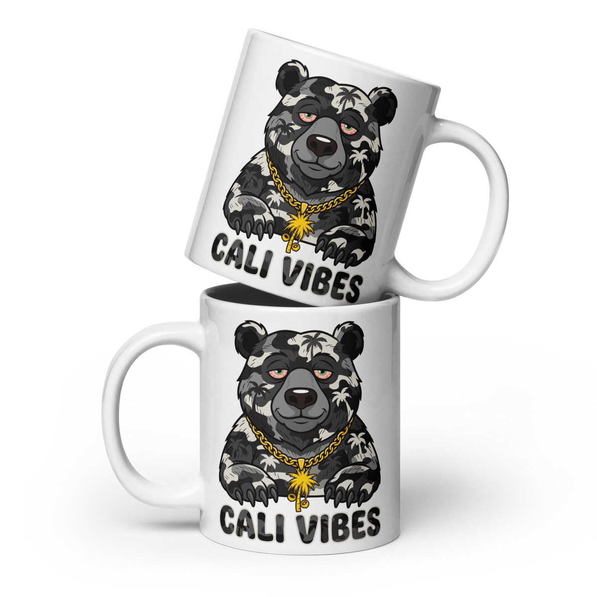 Two white ceramic mugs stacked with a cartoon bear graphic wearing a gold chain and the text 'CALI VIBES' printed on them, shown on a clean white background.