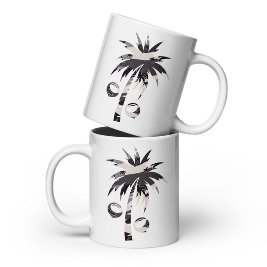 Two white ceramic mugs stacked with a tropical palm tree and coconut in tonal camo graphic printed on them, set against a clean white background.