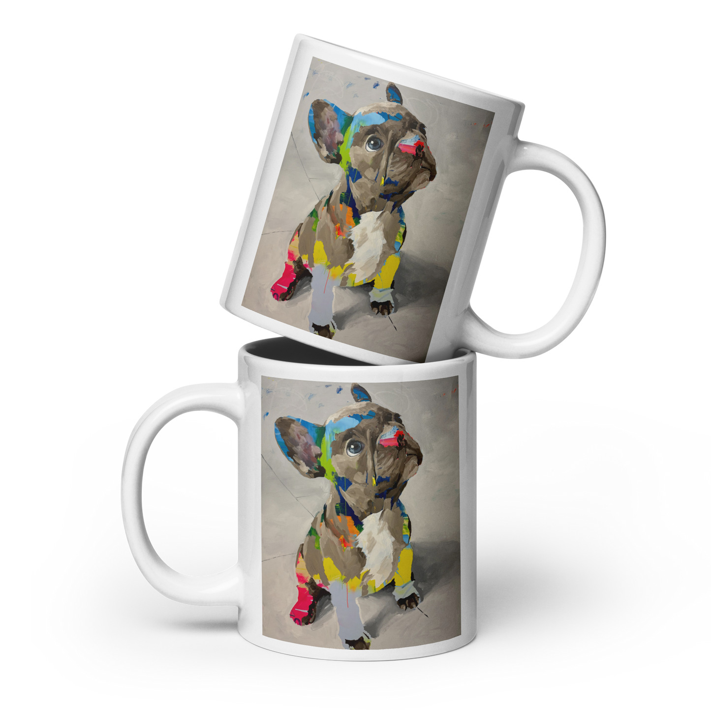 Two white ceramic mugs stacked with a French bulldog illustration printed on the side, shown on a clean white background. Daniel Maltzman artist.