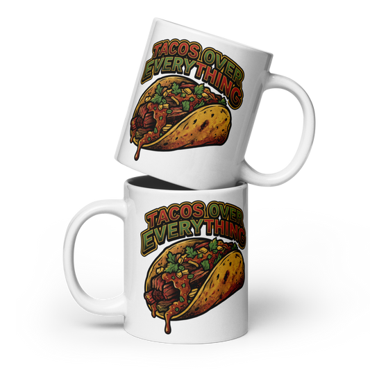 Two white ceramic mugs stacked on a white background, each printed with the phrase 'TACOS OVER EVERYTHING' above an illustrated taco filled with meat, beans, and vegetables.