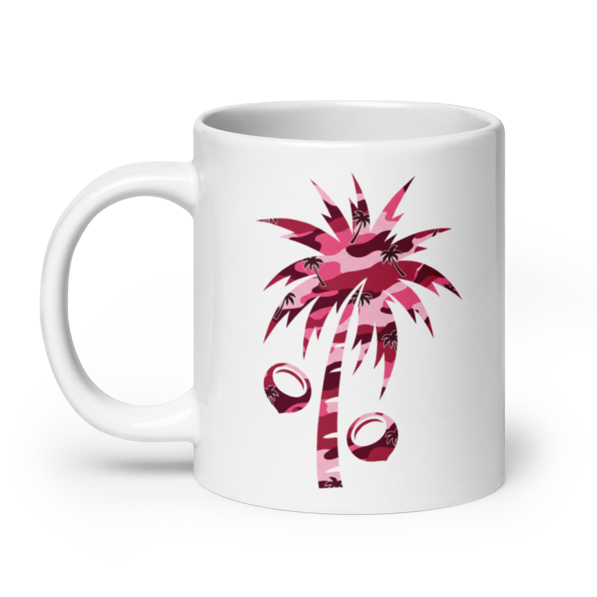 A white ceramic mug featuring a pink camouflage palm tree and coconut graphic on the side, set against a clean white background.