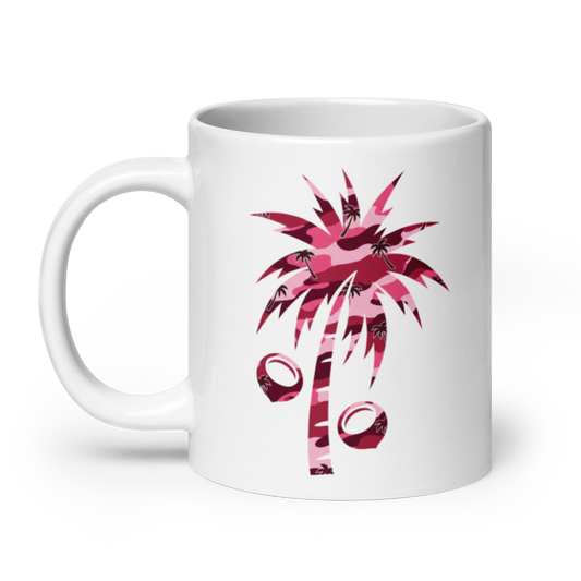 A white ceramic mug featuring a pink camouflage palm tree and coconut graphic on the side, set against a clean white background.