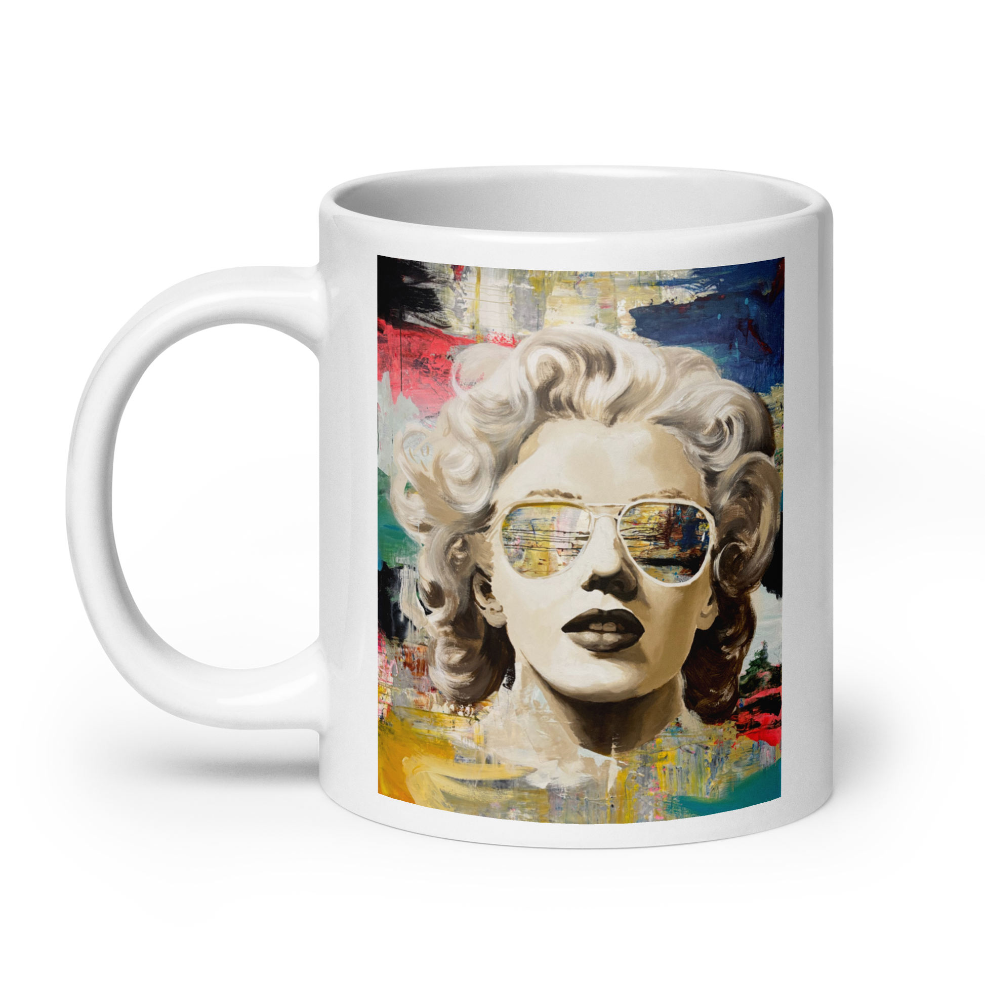 A white ceramic mug featuring a colorful pop-art style portrait of Marilyn Monroe wearing aviator sunglasses, shown on a clean white background. Daniel Maltzman original design.