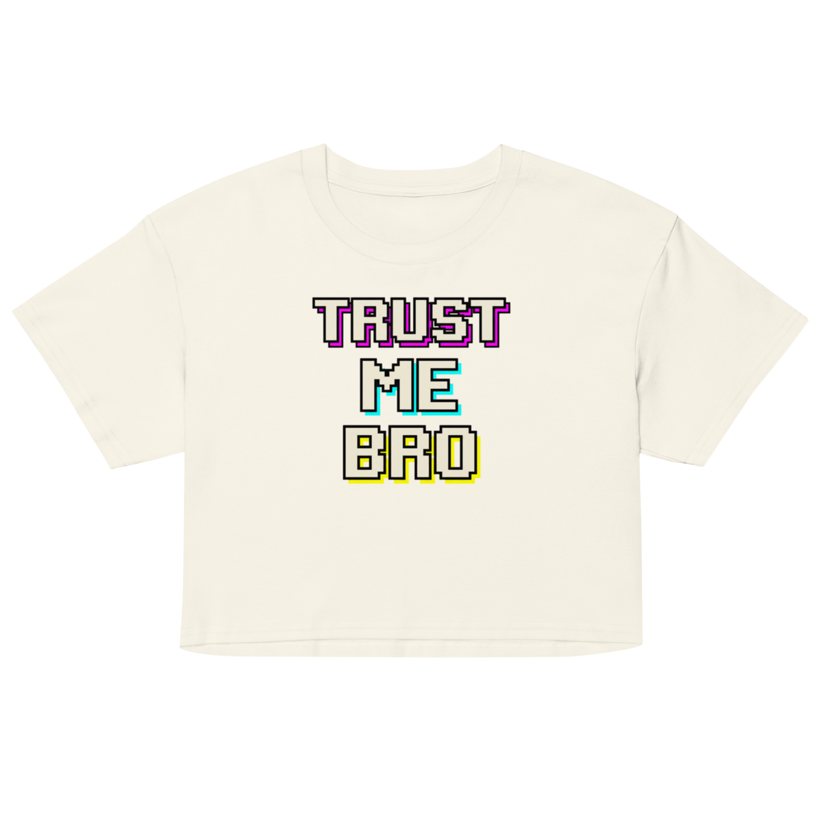 An off-white cropped t-shirt with a colorful retro pixelated graphic on the chest that reads 'TRUST ME BRO' in purple, cyan, and yellow.