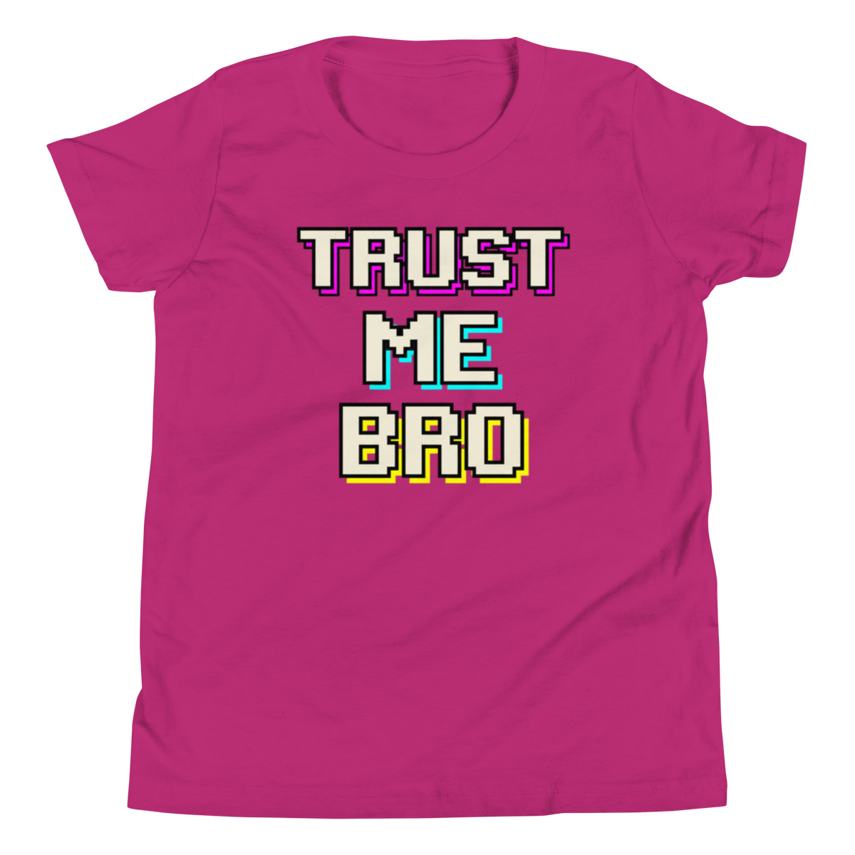 A bright pink short-sleeve t-shirt with a retro pixelated graphic reading 'TRUST ME BRO' in white, purple, cyan, and yellow block letters, shown on a plain white background.
