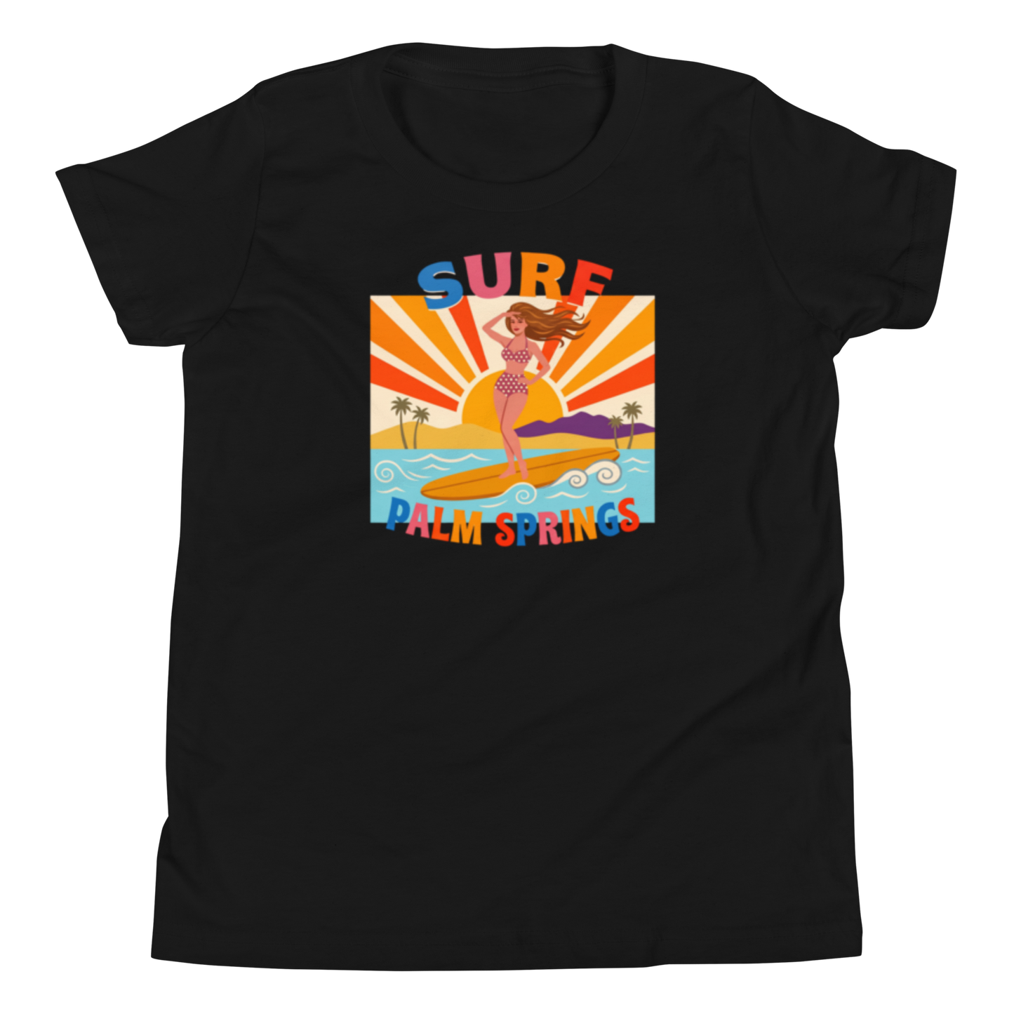 A black short-sleeve crewneck t-shirt featuring a colorful retro graphic of a mermaid surfing on a beach with the text 'SURF PALM SPRINGS'.